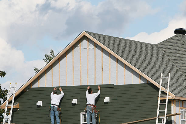 Professional Storm Damage Siding Repair technician working in Connellsville, PA